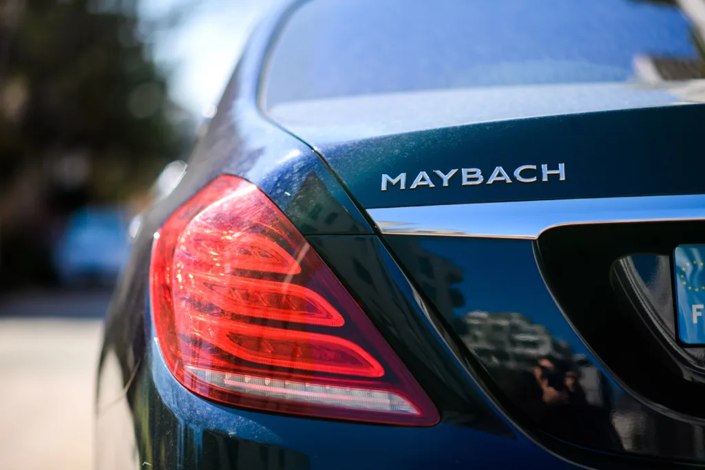 Strasbourg, France - Mar 22, 2020: Elegant luxury new Mercedes-Benz Maybach limousine parked on empty street - logotype sygn and rear red stop light