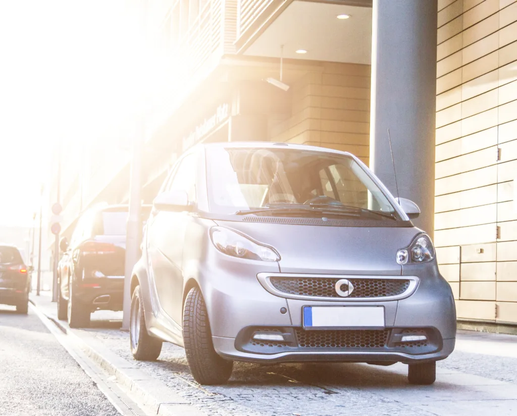 Berlin, Germany - December 9, 2014: The ultra-compact Smart car, a product of the Daimler AG, Stuttgart, parked in a public outdoor parking area.