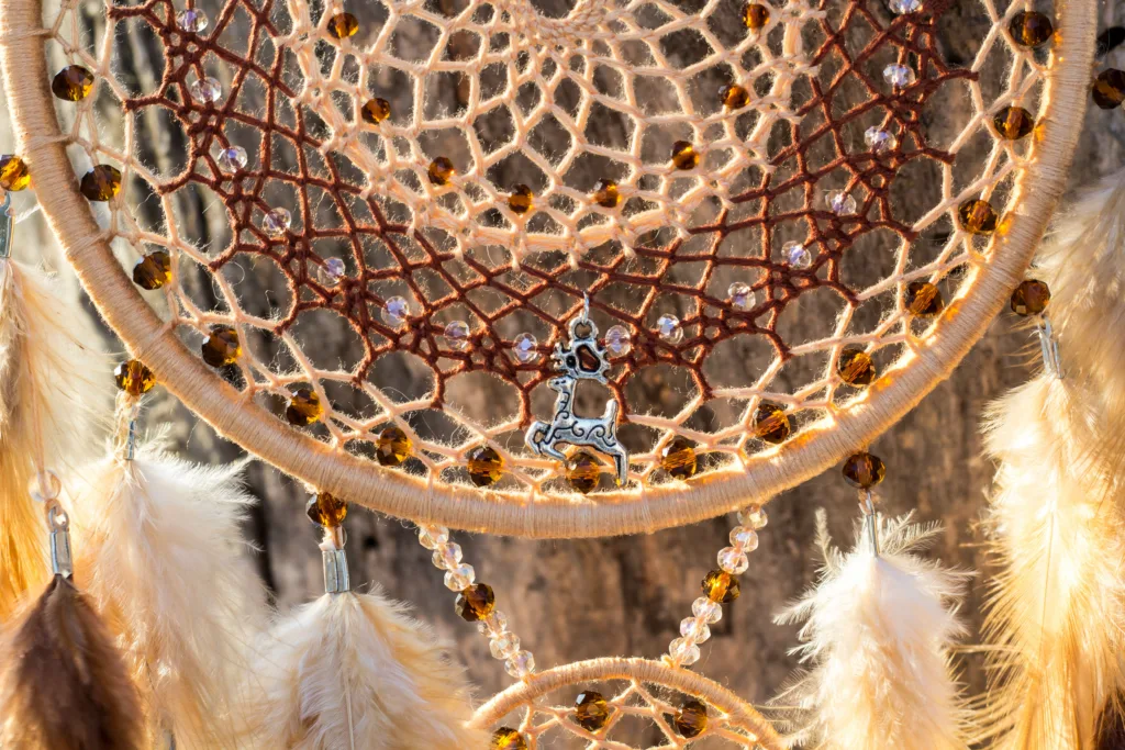 Dream catcher with feathers threads and beads rope hanging. Dreamcatcher handmade