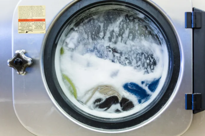 Industrial washing machines in a public laundromat.