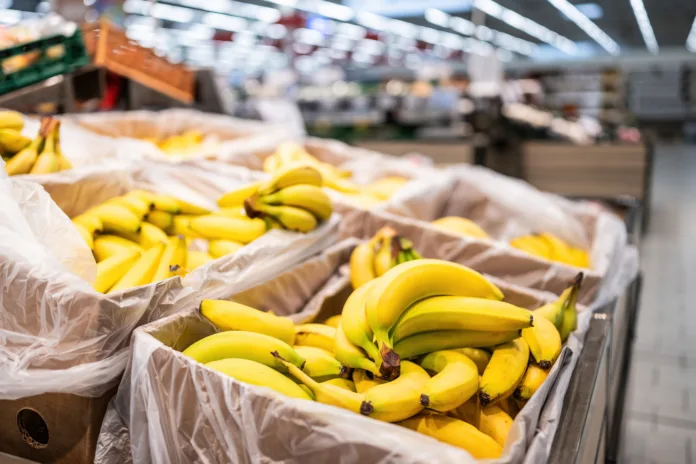 Boxes With Fresh Ripe Bananas In Supermarket