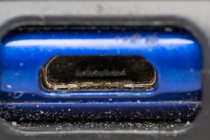 close-up with the dust from the  micro usb charging of a phone