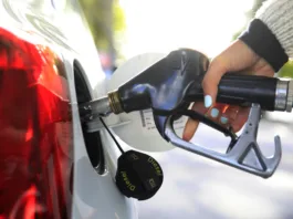 Close-up of a person refueling diesel at a petrol station