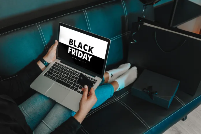 Online payment, Women hands holding credit card and using laptop for online shopping. Black Friday and Cyber Monday Concept