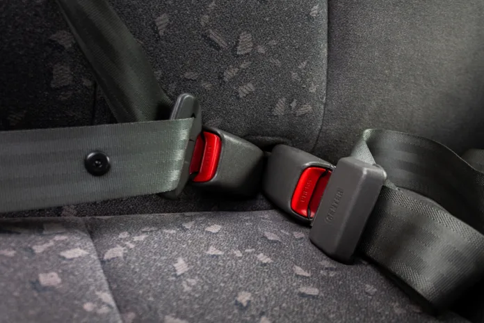 car three-point safety belt, buttoned, the concept of road safety, life and health of the driver and passengers, compliance with traffic rules