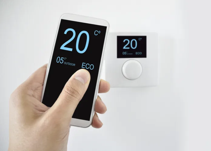 regulating the temperature from the smartphone and controlling the digital thermostat with finger pressing button