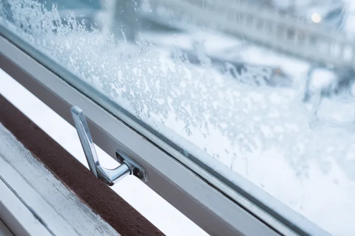 Window open with snowflake in winter season