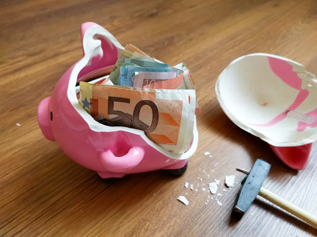 A broken pig piggy bank Euros inside