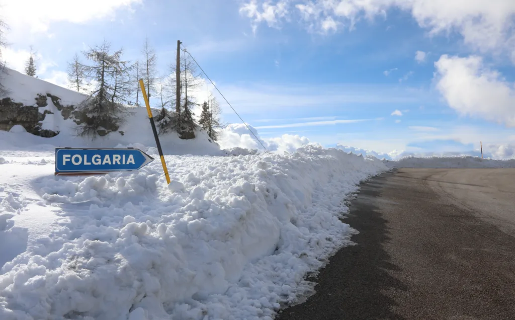 road sign with the writing of the locality FOLGARIA in northern Italy in winter with snow